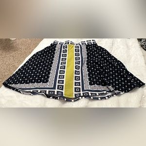 Women’s skirt with green and blue designs, hardly used and size Medium.